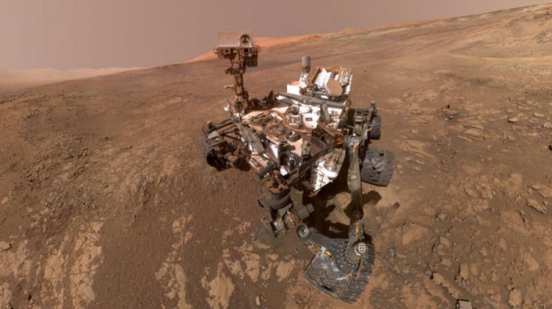 This composite image made from a series of Jan. 23, 2018 photos shows a self-portrait of NASA's Curiosity Mars rover on Vera Rubin Ridge. The rover's arm which held the camera was positioned out of each of the dozens of shots which make up the mosaic. (NASA/JPL-Caltech/MSSS via AP) This composite image made from a series of Jan. 23, 2018 photos shows a self-portrait of NASA's Curiosity Mars rover on Vera Rubin Ridge. The rover's arm which held the camera was positioned out of each of the dozens of shots which make up the mosaic. (NASA/JPL-Caltech/MSSS via AP)