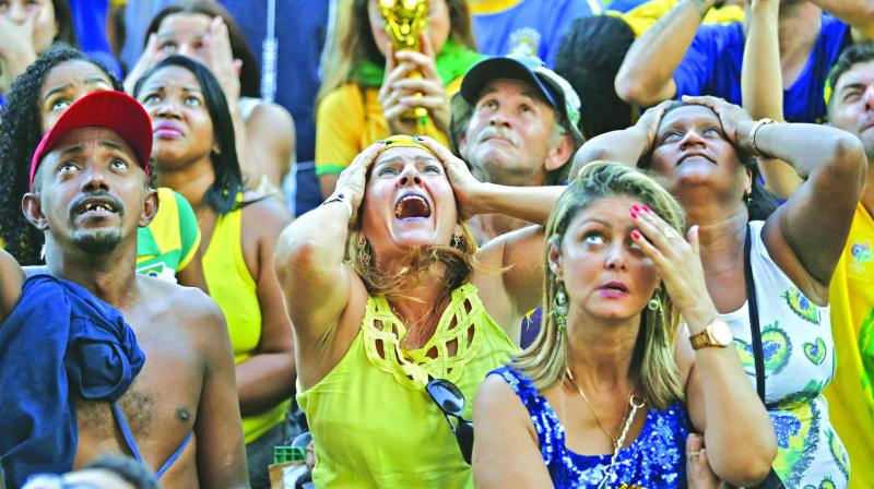 Brazil fans look crestfallen. (Photo: AP) Brazil fans look crestfallen. (Photo: AP)