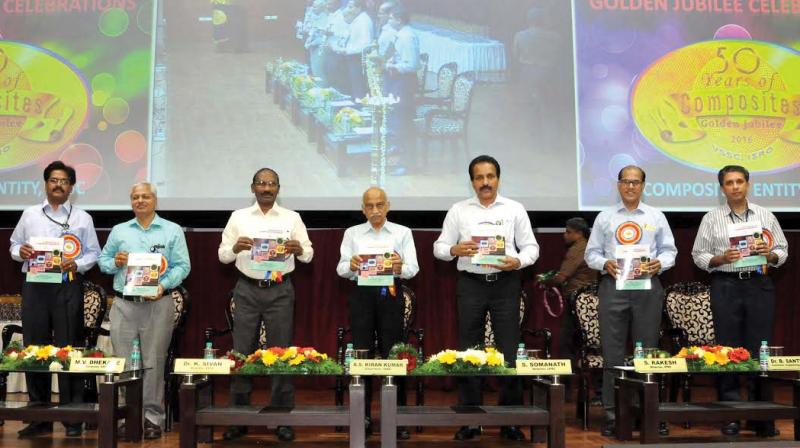 ISRO chairman A.S. Kiran Kumar releases 'Composites Entity - Centre of Excellence' at the golden jubilee celebrations of Composites at VSSC in Thiruvananthapuram on Monday. Also seen are (from L to R) A. Rajarajan, Dy. director, VSSC, M. V. Dhekane, Director IISU, Dr. K. Sivan, Director VSSC, S. Somanath, Director LPSC, S. Rakesh, Director IPRC and B. Santhosh, convener, organising committee. (Photo: DC) ISRO chairman A.S. Kiran Kumar releases 'Composites Entity - Centre of Excellence' at the golden jubilee celebrations of Composites at VSSC in Thiruvananthapuram on Monday. Also seen are (from L to R) A. Rajarajan, Dy. director, VSSC, M. V. Dhekane, Director IISU, Dr. K. Sivan, Director VSSC, S. Somanath, Director LPSC, S. Rakesh, Director IPRC and B. Santhosh, convener, organising committee. (Photo: DC)