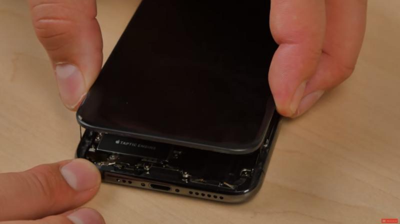 As can be seen from the video, the host completely dismantles the iPhone XS and the larger iPhone XS Max. (Image: YouTube screenshot/FixjeiPhone) As can be seen from the video, the host completely dismantles the iPhone XS and the larger iPhone XS Max. (Image: YouTube screenshot/FixjeiPhone)
