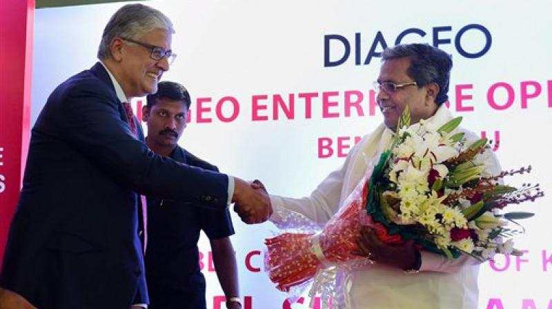 Karnataka Chief Minister Siddaramaiah with Ivan Menzes, Chief Executive,Diageo during the inauguration of the Diageo Enterprise Operations in Bengaluru. (Photo:PTI) Karnataka Chief Minister Siddaramaiah with Ivan Menzes, Chief Executive,Diageo during the inauguration of the Diageo Enterprise Operations in Bengaluru. (Photo:PTI)