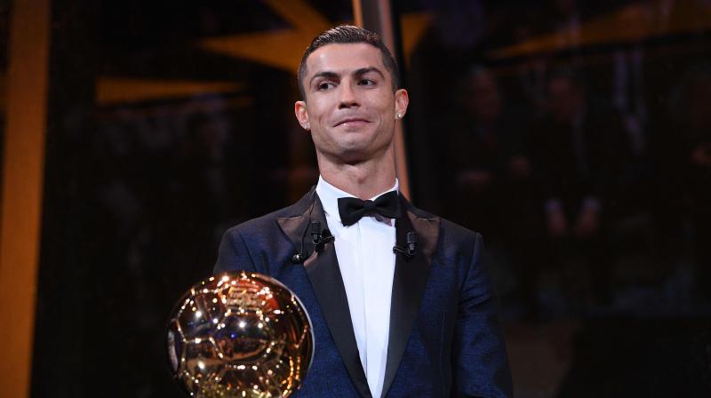 Cristiano Ronaldo was awarded the Ballon d‘Or for world player of the year on Thursday for a joint-record fifth time, going level with eternal rival and Barcelona forward Lionel Messi as the player to have won the prize the most times.(Photo: AFP) Cristiano Ronaldo was awarded the Ballon d‘Or for world player of the year on Thursday for a joint-record fifth time, going level with eternal rival and Barcelona forward Lionel Messi as the player to have won the prize the most times.(Photo: AFP)