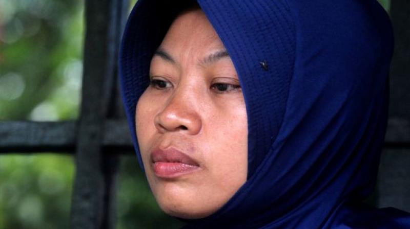 Parliament's approval was met by loud applause as the tearful mother of three who was in the chamber covered her face with her hands before kissing the ground. (Photo: AFP) Parliament's approval was met by loud applause as the tearful mother of three who was in the chamber covered her face with her hands before kissing the ground. (Photo: AFP)