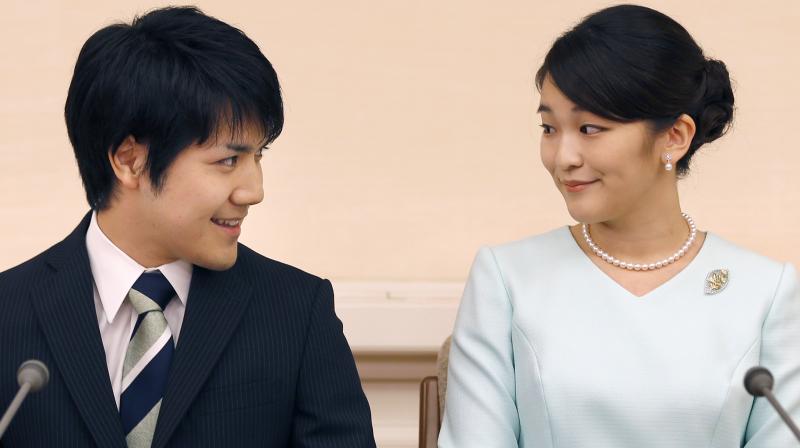 Japanese Emperor Akihito's oldest grandchild, Princess Mako, says she is getting married to her university classmate who won her heart with bright smiles and sincerity. (Photo: AP) Japanese Emperor Akihito's oldest grandchild, Princess Mako, says she is getting married to her university classmate who won her heart with bright smiles and sincerity. (Photo: AP)