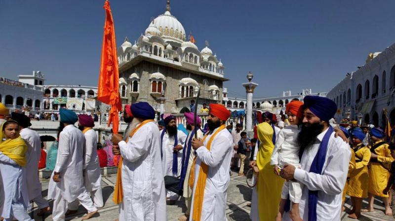 Sikh pilgrims march during the Baisakhi festival, at the shrine of Gurdwara Punja Sahib in Hasan Abdal, some 50 kilometers from Islamabad, Pakistan, April 14, 2018.(Photo: AP) Sikh pilgrims march during the Baisakhi festival, at the shrine of Gurdwara Punja Sahib in Hasan Abdal, some 50 kilometers from Islamabad, Pakistan, April 14, 2018.(Photo: AP)