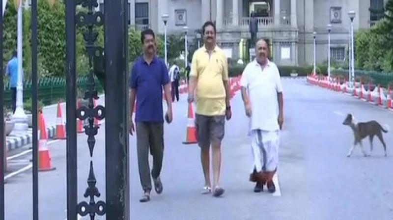 Some of the legislators, who were part of the unprecedented overnight 'dharna' at the Vidhana Soudha over their demand of floor test took a stroll around the assembly house after waking up early in the morning. (Photo: ANI) Some of the legislators, who were part of the unprecedented overnight 'dharna' at the Vidhana Soudha over their demand of floor test took a stroll around the assembly house after waking up early in the morning. (Photo: ANI)