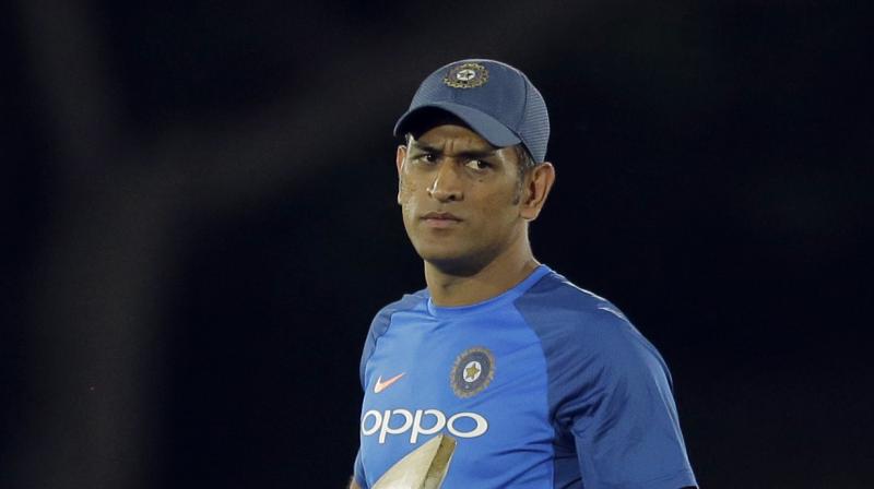 In a video posted by Kolkata Police on their Facebook page, MS Dhoni is seen aiming with a pistol and firing a couple of rounds. (Photo: AP) In a video posted by Kolkata Police on their Facebook page, MS Dhoni is seen aiming with a pistol and firing a couple of rounds. (Photo: AP)