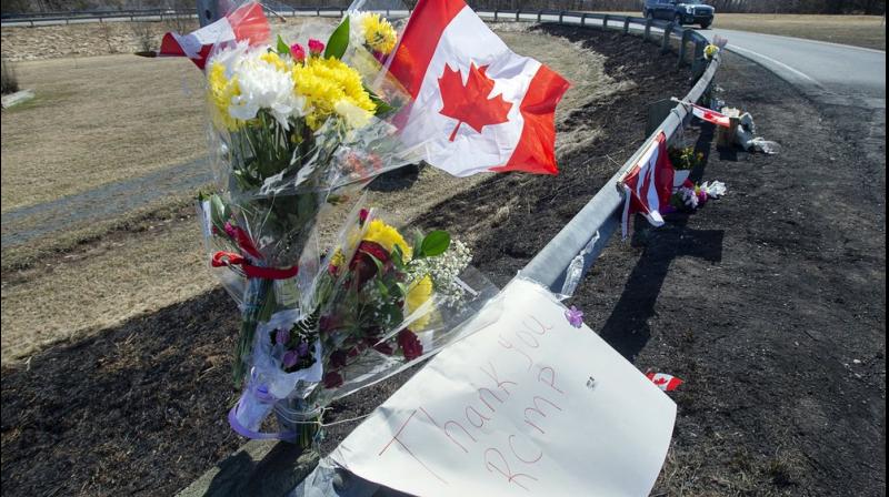 A memorial pays tribute to Royal Canadian Mounted Police Constable Heidi Stevenson, a mother of two and a 23-year veteran of the force, along the highway in Shubenacadie, Nova Scotia. (AP Photo) A memorial pays tribute to Royal Canadian Mounted Police Constable Heidi Stevenson, a mother of two and a 23-year veteran of the force, along the highway in Shubenacadie, Nova Scotia. (AP Photo)