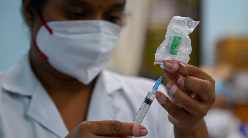 A health worker prepares a dose of the Covishield vaccine against the Covid-19 coronavirus, at a vaccination centre in Rajawadi Hospital in Mumbai. (Photo: AFP)