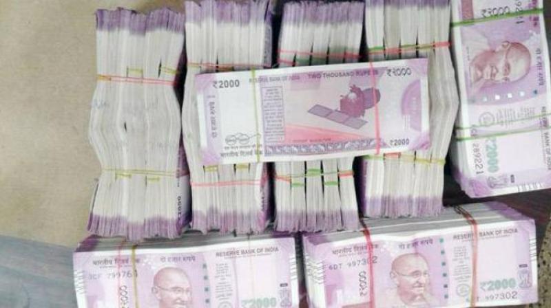 On checking the boxes, the sleuths found several bundles of cash in Rs 2,000, Rs 500, Rs 200 and Rs 100 denomination. (Representational Images) On checking the boxes, the sleuths found several bundles of cash in Rs 2,000, Rs 500, Rs 200 and Rs 100 denomination. (Representational Images)