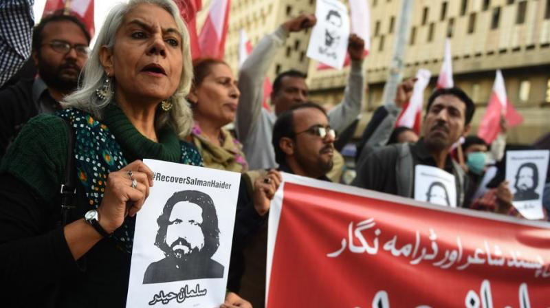 Pakistani human rights activists hold images of bloggers who have gone missing during a protest in Peshawar on January 10, 2017. Four bloggers who campaigned for human rights and religious freedom, went missing from various cities between January 4 and January 7 2017.(Photo: AFP) Pakistani human rights activists hold images of bloggers who have gone missing during a protest in Peshawar on January 10, 2017. Four bloggers who campaigned for human rights and religious freedom, went missing from various cities between January 4 and January 7 2017.(Photo: AFP)