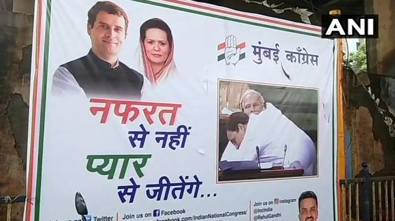 The posters, put by the Congress workers, have a tagline that reads: 'Nafrat se nahi, Pyar se jeetenge.' (Photo: Twitter | ANI) The posters, put by the Congress workers, have a tagline that reads: 'Nafrat se nahi, Pyar se jeetenge.' (Photo: Twitter | ANI)