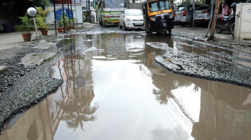 The huge crater formed at St Benedict road near North railway station in Kochi following heavy rains. (file pic) The huge crater formed at St Benedict road near North railway station in Kochi following heavy rains. (file pic)