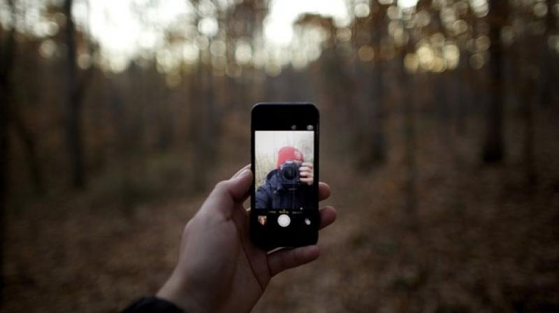 These impulsive selfie takers take the risk of getting into dangerous situations to take unique and out of the way selfies, such as on the edge of a mountain cliff, very close by a waterfall, dam or river, or on the railway tracks. (Representional Image) These impulsive selfie takers take the risk of getting into dangerous situations to take unique and out of the way selfies, such as on the edge of a mountain cliff, very close by a waterfall, dam or river, or on the railway tracks. (Representional Image)