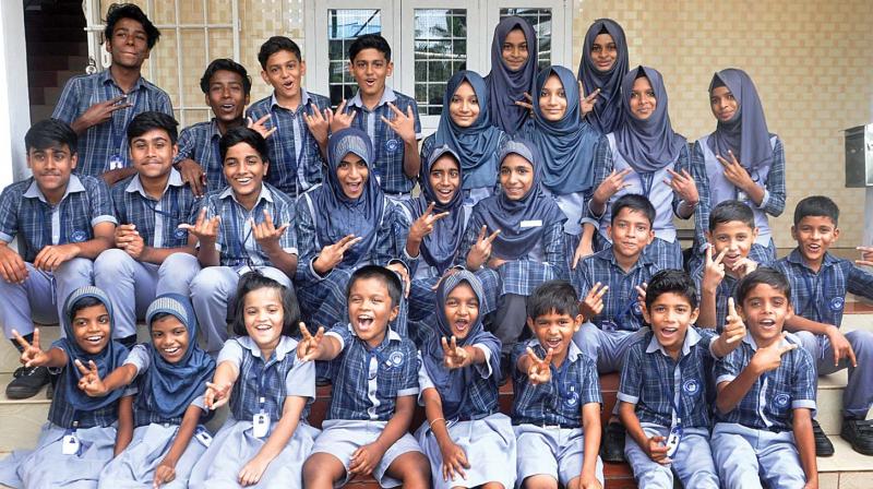 Twins of Najath Public School, Kalamassery, in Kochi exult as majority come together to pose for a group photo. (Photo: SUNOJ NINAN MATHEW) Twins of Najath Public School, Kalamassery, in Kochi exult as majority come together to pose for a group photo. (Photo: SUNOJ NINAN MATHEW)