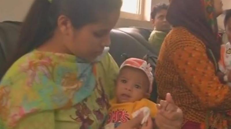 Appreciate EAM Sushma Swaraj, she helped me a lot, father of the infant Rohaan, who arrived in India for treatment said. (Photo: ANI/Twitter) Appreciate EAM Sushma Swaraj, she helped me a lot, father of the infant Rohaan, who arrived in India for treatment said. (Photo: ANI/Twitter)