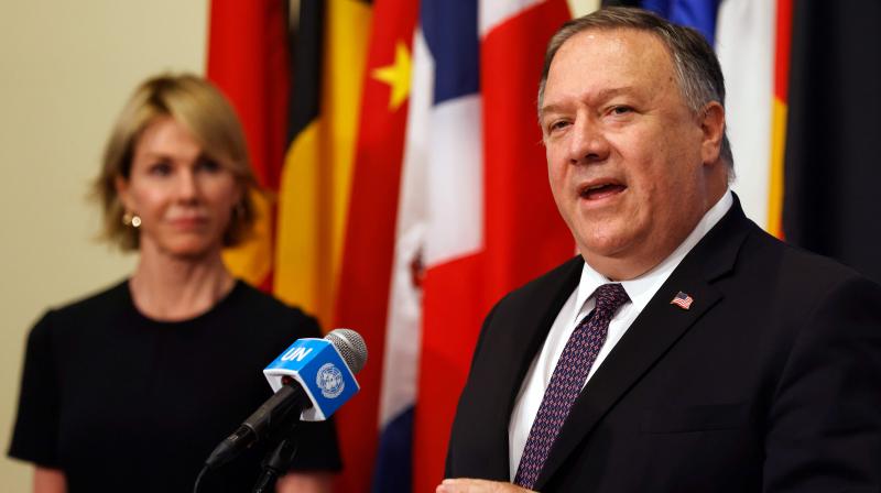 US Secretary of State Mike Pompeo is flanked by US Ambassador to the United Nations Kelly Craft as he speaks to reporters following a meeting with members of the UN Security Council about Irans alleged non-compliance with a nuclear deal and calling for the restoration of sanctions against Iran at United Nations hradquarters in New York. (AFP)