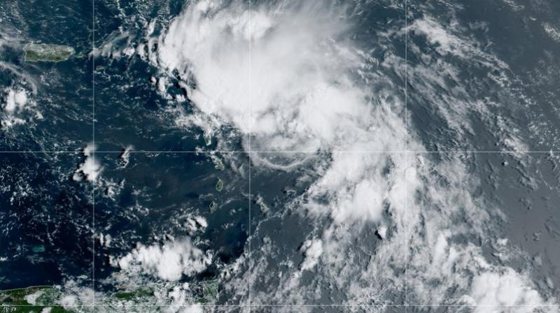 This satellite image released by the National Oceanic and Atmospheric Administration (NOAA) shows Tropical Storm Laura in the North Atlantic Ocean, Friday, Aug. 21, 2020. Laura formed Friday in the eastern Caribbean and forecasters said it poses a potential hurricane threat to Florida and the U.S. Gulf Coast. A second storm also may hit the U.S. after running into Mexicos Yucatan Peninsula. (NOAA via AP)