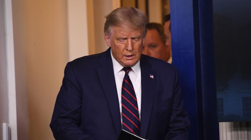 US President Donald Trump arrives for a press conference in the Press Briefing Room of the White House in Washington, DC. (AFP)