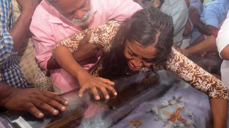 Kevin Joseph’s father Joseph Jacob tries to console his daughter-in-law Neenu Chacko at his house at Nattasseri in Kottayam on Tuesday. (Photo: Rajeev Prasad) Kevin Joseph’s father Joseph Jacob tries to console his daughter-in-law Neenu Chacko at his house at Nattasseri in Kottayam on Tuesday. (Photo: Rajeev Prasad)