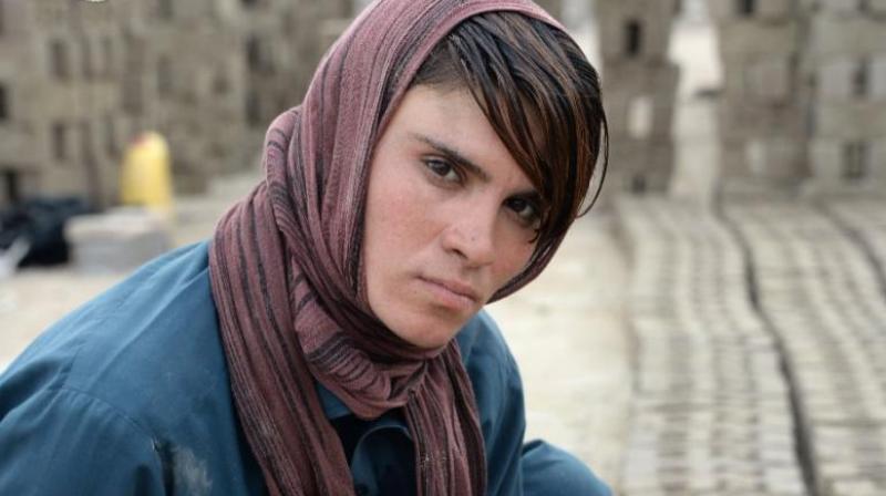 The 18-year-old, who resides with her impoverished family in a mud-brick house in a village in Afghanistan's eastern province of Nangarhar, has pretended to be a boy for most of her life. (Photo: AFP) The 18-year-old, who resides with her impoverished family in a mud-brick house in a village in Afghanistan's eastern province of Nangarhar, has pretended to be a boy for most of her life. (Photo: AFP)