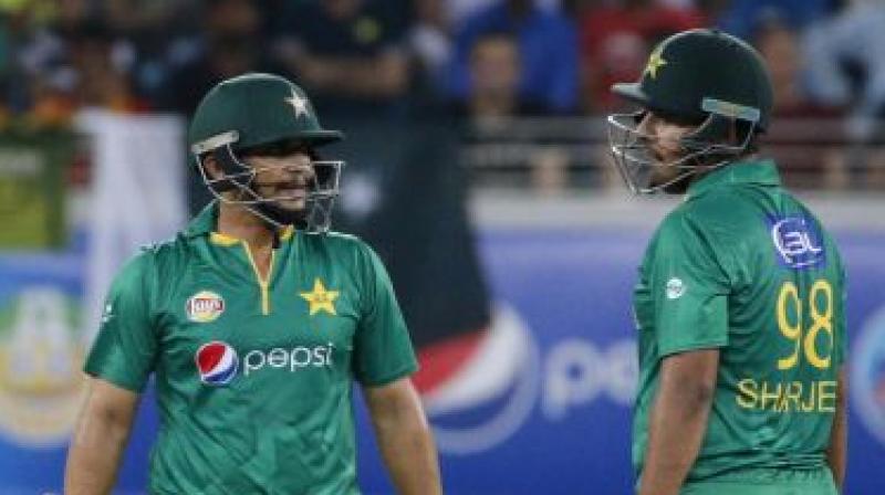 Khalid Latif (L) and Sharjeel Khan in action for Pakistan. (Photo: AFP) Khalid Latif (L) and Sharjeel Khan in action for Pakistan. (Photo: AFP)