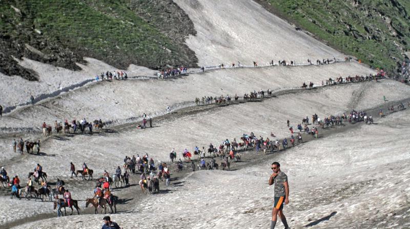 The annual pilgrimage to the cave shrine commenced on Monday from both Baltal and Pahalgam routes in the Kashmir valley. (Photo: PTI) The annual pilgrimage to the cave shrine commenced on Monday from both Baltal and Pahalgam routes in the Kashmir valley. (Photo: PTI)
