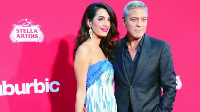 George Clooney with wife Amal George Clooney with wife Amal