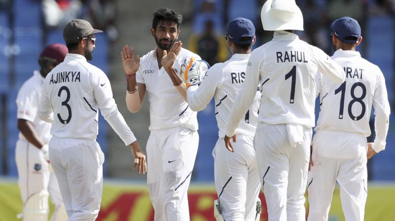 JAsprit Bumrah recently became the fastest Indian pacer to 50 Test wickets, during his six-wicket match haul against the West Indies in the first Test here, which India won by 318 runs on Sunday. (Photo:AP/PTI) JAsprit Bumrah recently became the fastest Indian pacer to 50 Test wickets, during his six-wicket match haul against the West Indies in the first Test here, which India won by 318 runs on Sunday. (Photo:AP/PTI)