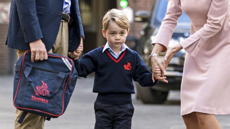Britain's Prince William accompanies Prince George as he is met by Helen Haslem - the head of the lower school on arrival for his first day of school at Thomas's school in Battersea, London, Thursday, Sept. 7, 2017. (Photo: AP) Britain's Prince William accompanies Prince George as he is met by Helen Haslem - the head of the lower school on arrival for his first day of school at Thomas's school in Battersea, London, Thursday, Sept. 7, 2017. (Photo: AP)