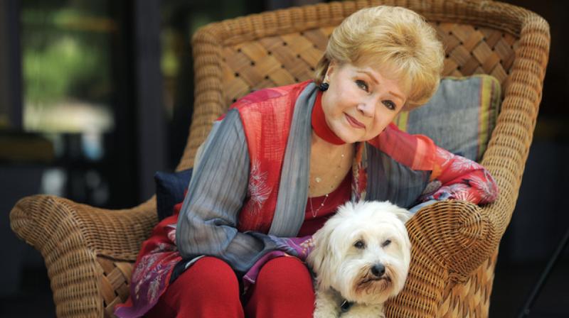 In this file photo, Debbie Reynolds, poses for a portrait with her dog, Dwight, in Beverly Hills, California. (Photo: AP) In this file photo, Debbie Reynolds, poses for a portrait with her dog, Dwight, in Beverly Hills, California. (Photo: AP)