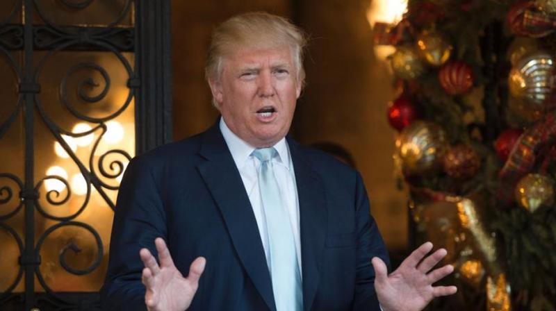 US President-elect Donald Trump answers questions from the media after a day of meetings on December 28, 2016 at Mar-a-Lago in Palm Beach, Florida. (Photo: AFP) US President-elect Donald Trump answers questions from the media after a day of meetings on December 28, 2016 at Mar-a-Lago in Palm Beach, Florida. (Photo: AFP)
