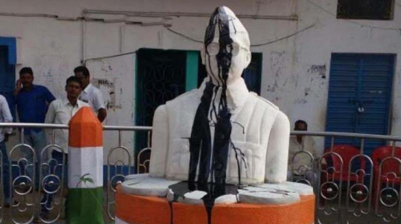 On Tuesday morning when the gate of the panchayat office was opened it was found that the statue was smeared with coal tar and face was partly damaged, the police said. (Photo: ANI/Twitter) On Tuesday morning when the gate of the panchayat office was opened it was found that the statue was smeared with coal tar and face was partly damaged, the police said. (Photo: ANI/Twitter)