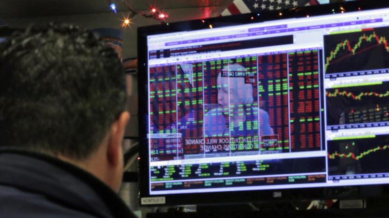 Federal Reserve Chair Janet Yellen's news conference in Washington is reflected on a specialist's screen on the floor of the New York Stock Exchange. (Photo:AP) Federal Reserve Chair Janet Yellen's news conference in Washington is reflected on a specialist's screen on the floor of the New York Stock Exchange. (Photo:AP)
