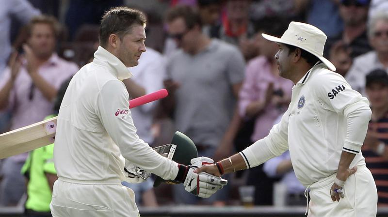 Sachin Tendulkar congratulates Michael Clarke on hitting 250 runs in the Sydney Test of the 2012 series. AP Photo