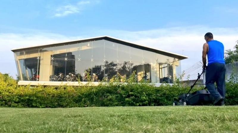 Dhoni mowing the lawns at his house. CSK Twitter Photo