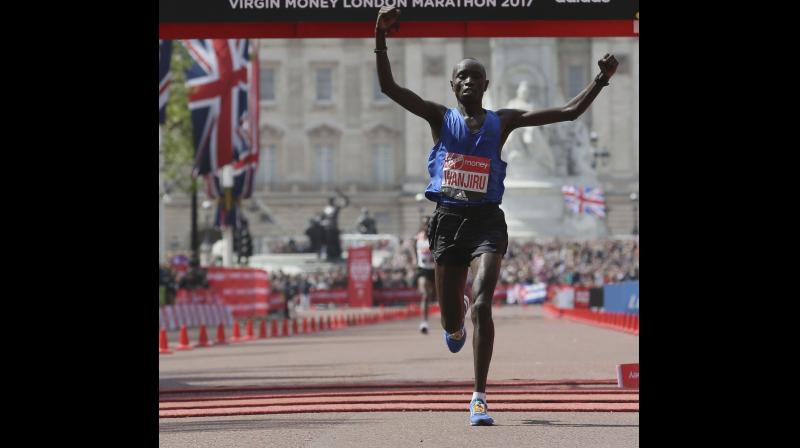 Kenyas Daniel Wanjiru crosses the finish line to win the London Marathon.on April 23, 2017. AP Photo