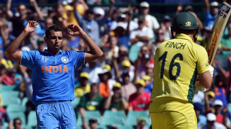 File photo of India's Mohammed Shami (L) reacting after beating Australia's Aaron Finch with a seaming delivery during the 2015 World Cup semi-final at the Sydney Cricket Ground on March 26, 2015. AFP Photo File photo of India's Mohammed Shami (L) reacting after beating Australia's Aaron Finch with a seaming delivery during the 2015 World Cup semi-final at the Sydney Cricket Ground on March 26, 2015. AFP Photo