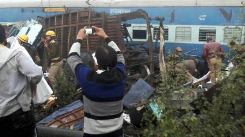 Rescue officials on the spot where 14 coaches of the Indore-Patna express derailed, killing around 90 people and injuring 150, in Kanpur Dehat on Sunday. (Photo: PTI) Rescue officials on the spot where 14 coaches of the Indore-Patna express derailed, killing around 90 people and injuring 150, in Kanpur Dehat on Sunday. (Photo: PTI)