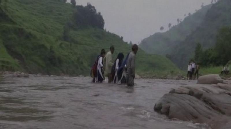 The locals have also been demanding the government to build a bridge so that children from underprivileged backgrounds, for whom, government schools are the last option, can attend schools on a regular basis. (Photo: ANI) The locals have also been demanding the government to build a bridge so that children from underprivileged backgrounds, for whom, government schools are the last option, can attend schools on a regular basis. (Photo: ANI)