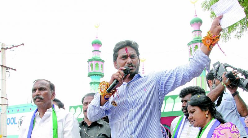 YSRC president Y.S. Jagan Mohan Reddy at a road show held in Harijanwada, Nandyal in Kurnool district on Thursday. (Photo: DC) YSRC president Y.S. Jagan Mohan Reddy at a road show held in Harijanwada, Nandyal in Kurnool district on Thursday. (Photo: DC)