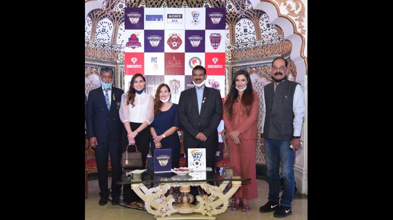 Handball Federation of India president Arshnapally Jagan Mohan Rao (third from right) poses after the launch of Premier Handball League in Jaipur on Saturday. Handball Federation of India president Arshnapally Jagan Mohan Rao (third from right) poses after the launch of Premier Handball League in Jaipur on Saturday.