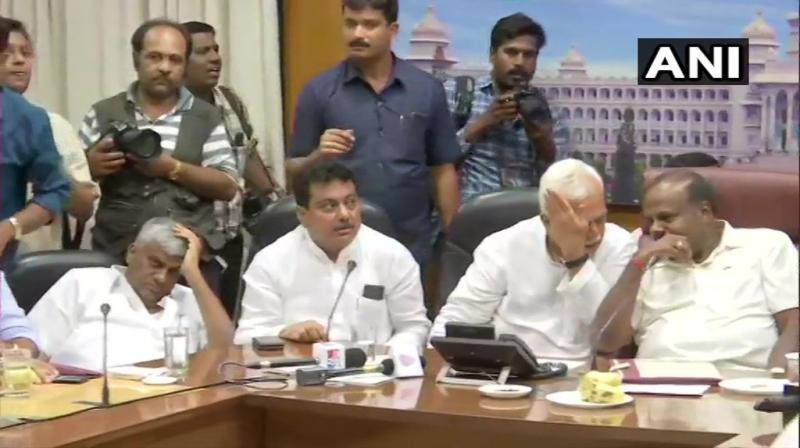 Asserting that all their MLAs were with them, Deputy CM G Parameshwara said the coalition would continue under Kumaraswamy's leadership and that there was no threat to the government. (Photo: ANI) Asserting that all their MLAs were with them, Deputy CM G Parameshwara said the coalition would continue under Kumaraswamy's leadership and that there was no threat to the government. (Photo: ANI)