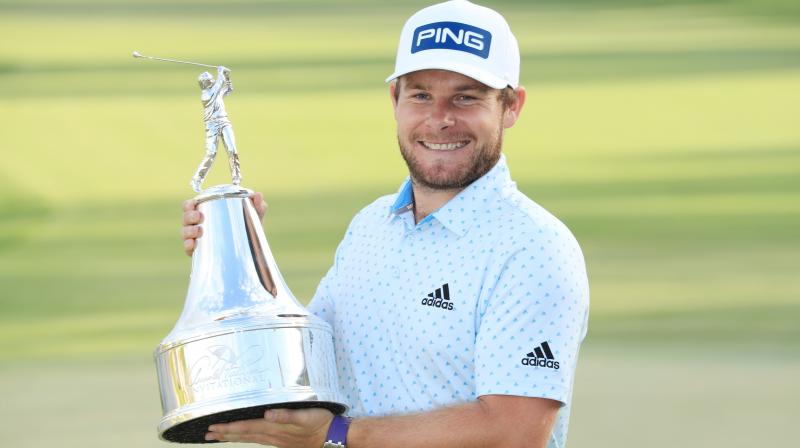 Tyrrell Hatton of England displays the trophy after winning the Arnold Palmer Invitational Presented at the Bay Hill Club and Lodge in Orlando, Florida, on Sunday. AFP Photo