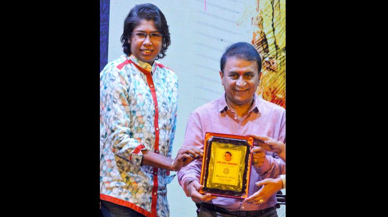 Jhulan Goswami presenting the Lifetime Achievemen award to Sunil Gavaskar in Kolkata. PTI Photo