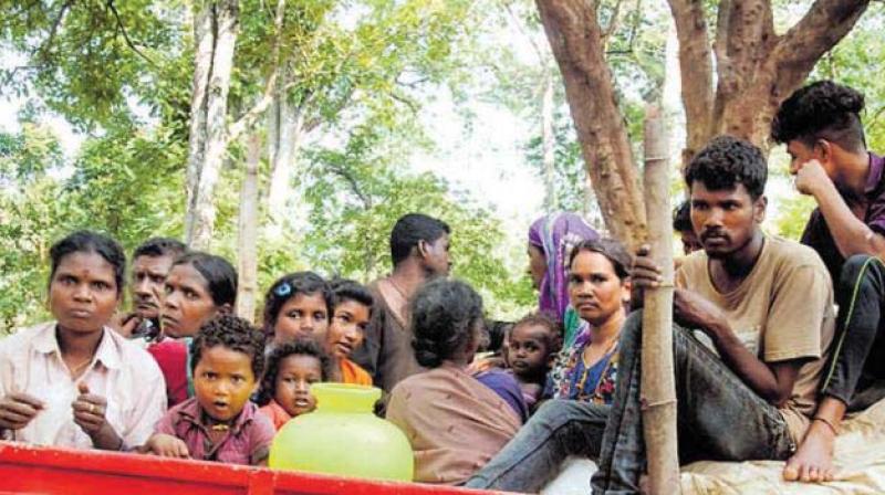 Diddalli tribals being taken to Byadagudda in Somwarpet. Diddalli tribals being taken to Byadagudda in Somwarpet.