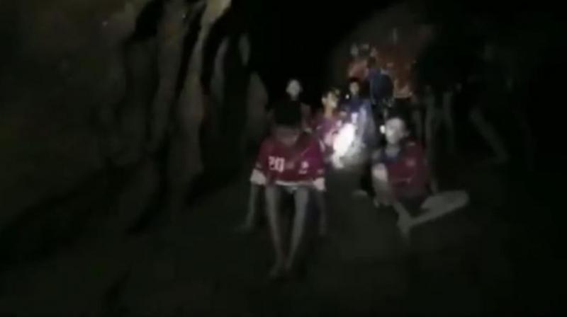 They appeared exhausted, rake thin, sensitive to the light but lucid, with some speaking faltering English to try to communicate with the unidentified diver. (Photo: Screengrab/AFP) They appeared exhausted, rake thin, sensitive to the light but lucid, with some speaking faltering English to try to communicate with the unidentified diver. (Photo: Screengrab/AFP)