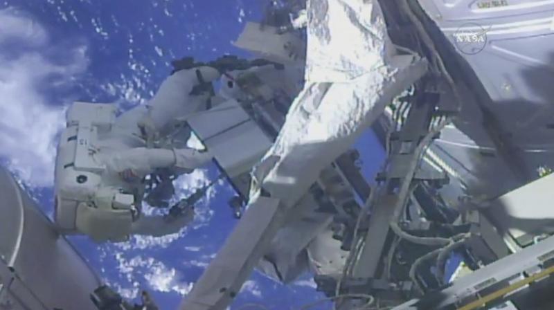 In this frame from NASA TV, NASA astronaut Ricky Arnold, left, and NASA astronaut Drew Feustel work on shuffling around a couple of space station pumps at the International Space Station on Wednesday, May 16, 2018. (NASA TV via AP) In this frame from NASA TV, NASA astronaut Ricky Arnold, left, and NASA astronaut Drew Feustel work on shuffling around a couple of space station pumps at the International Space Station on Wednesday, May 16, 2018. (NASA TV via AP)