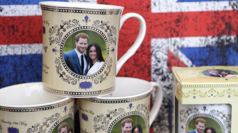 Mugs with the image of Britain's Prince Harry and Meghan Markle are seen displayed for sale in a shop window in Windsor, England, Thursday, March 29, 2018. (Photo: AP) Mugs with the image of Britain's Prince Harry and Meghan Markle are seen displayed for sale in a shop window in Windsor, England, Thursday, March 29, 2018. (Photo: AP)