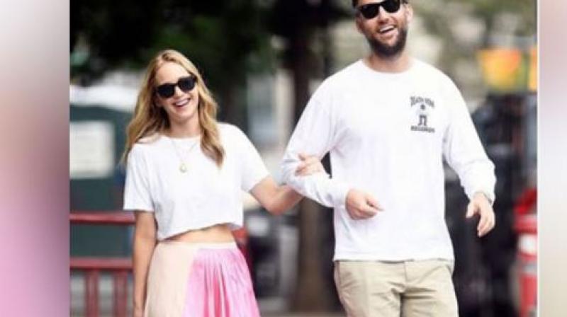 Jennifer Lawrence and Cooke Maroney. Jennifer Lawrence and Cooke Maroney.